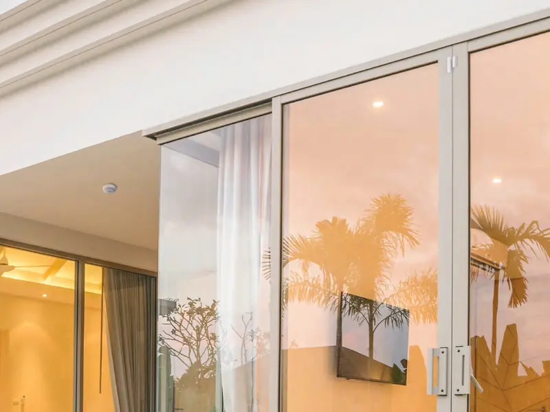 Large glass sliding doors protected by a sensor