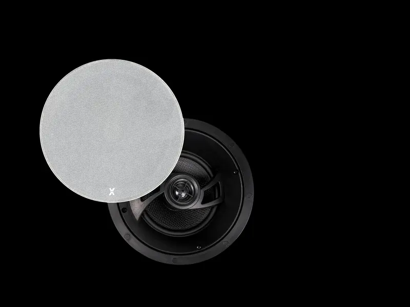 Round in-ceiling speaker with its paintable grille removed